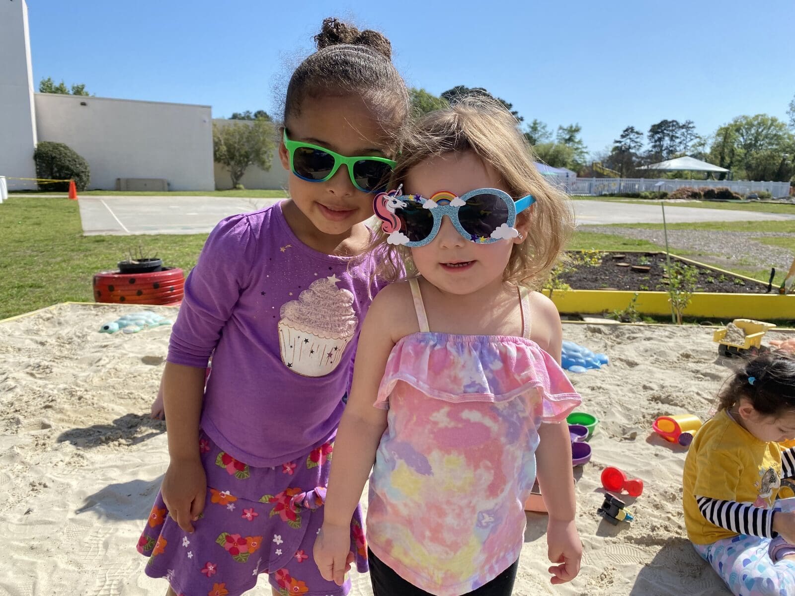 Two girls are playing sandbox play at IB School